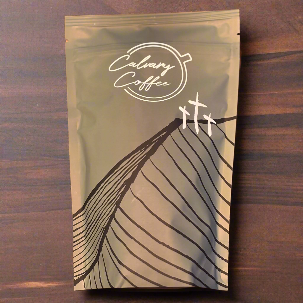 Calvary Coffee bag on a walnut table