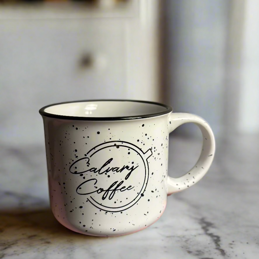 Calvary Coffee logo on front of white campfire mug