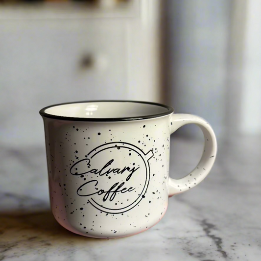 Calvary Coffee logo on front of white campfire mug