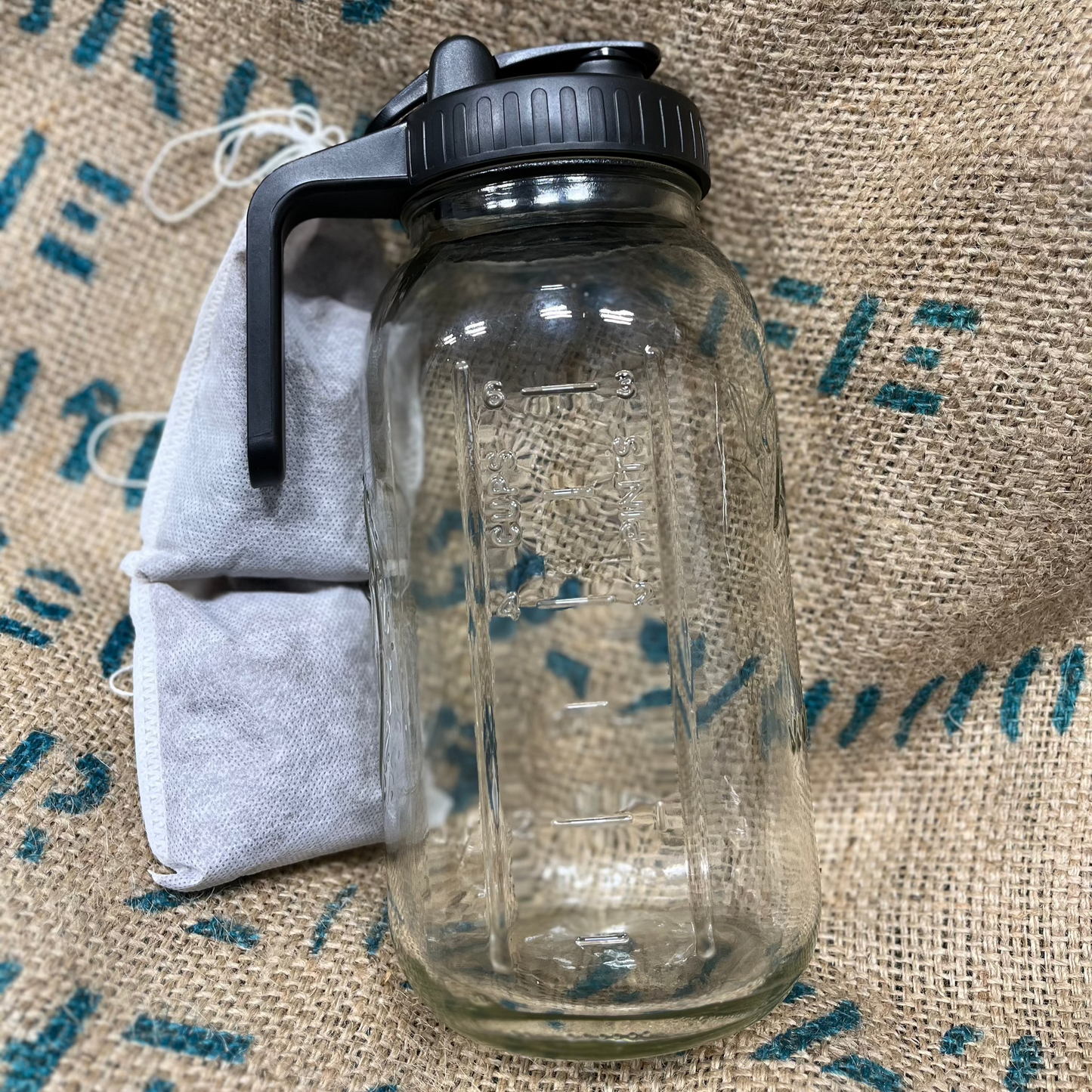 Calvary Coffee kit with glass jar, pour lid, and two cold brew bags